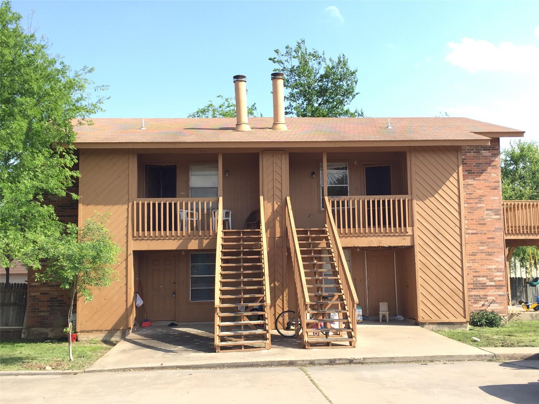 Two-story building featuring exterior staircases 