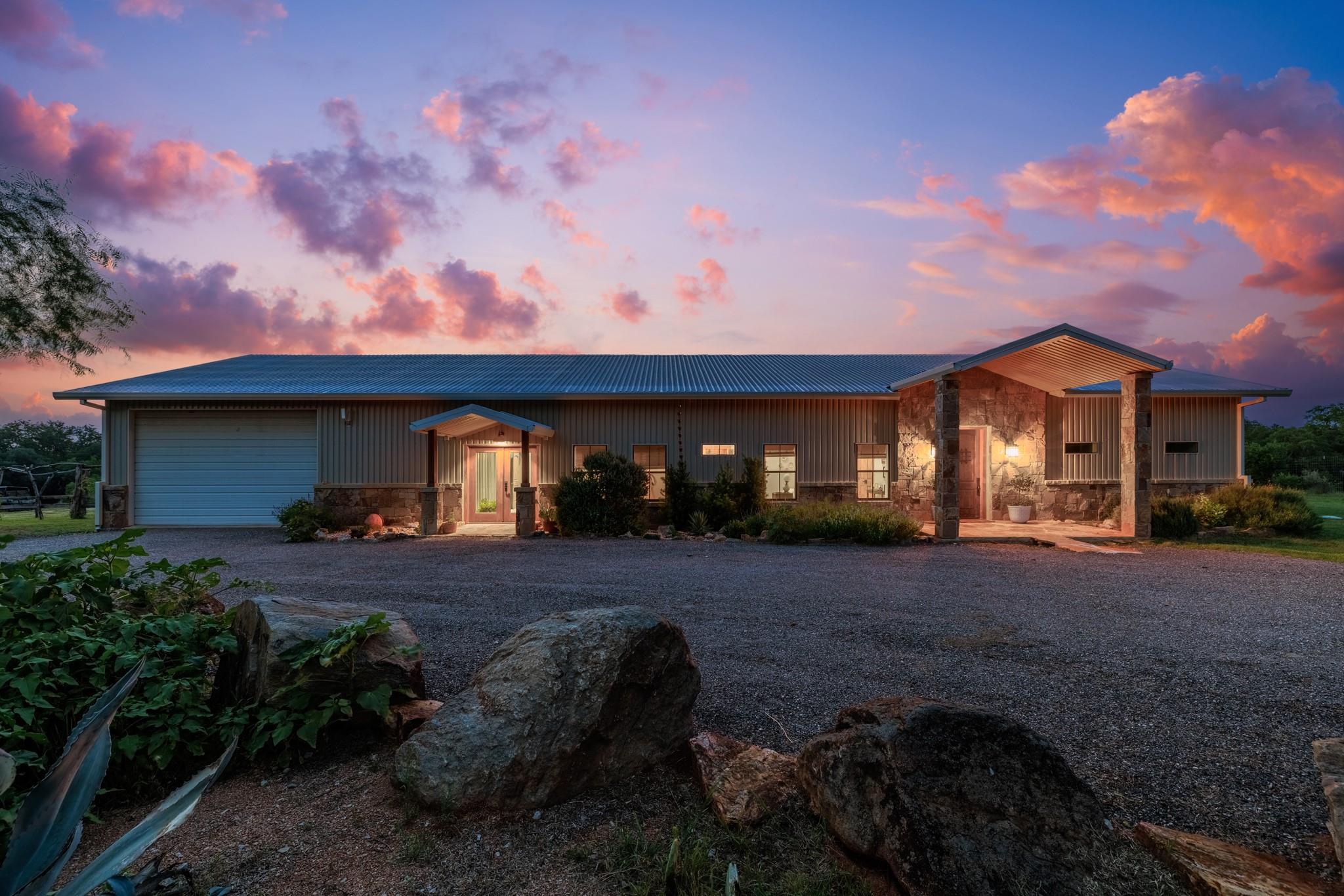 Corrugated metal siding exterior with stone accen