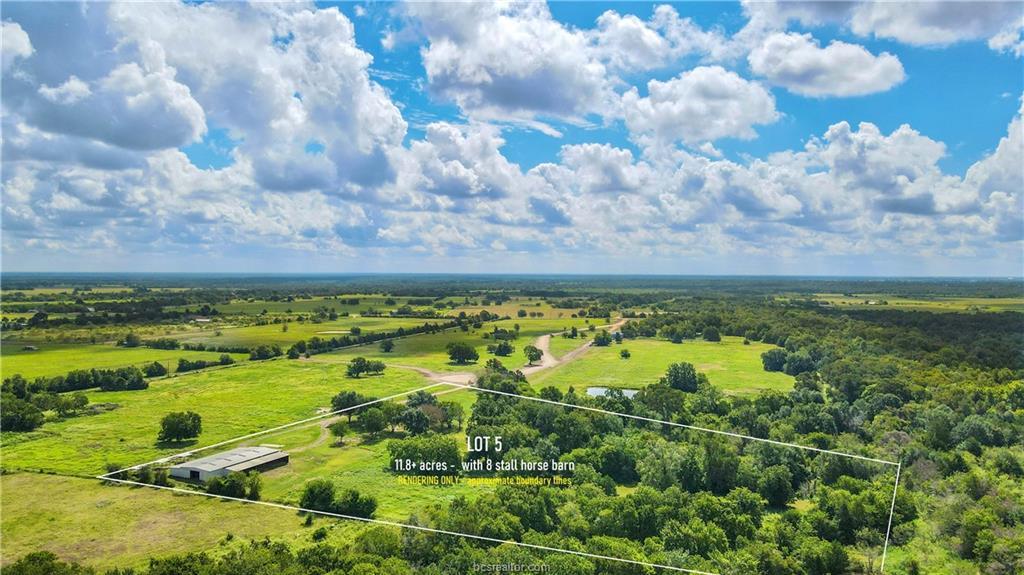 Expansive rural landscape featuring a large green