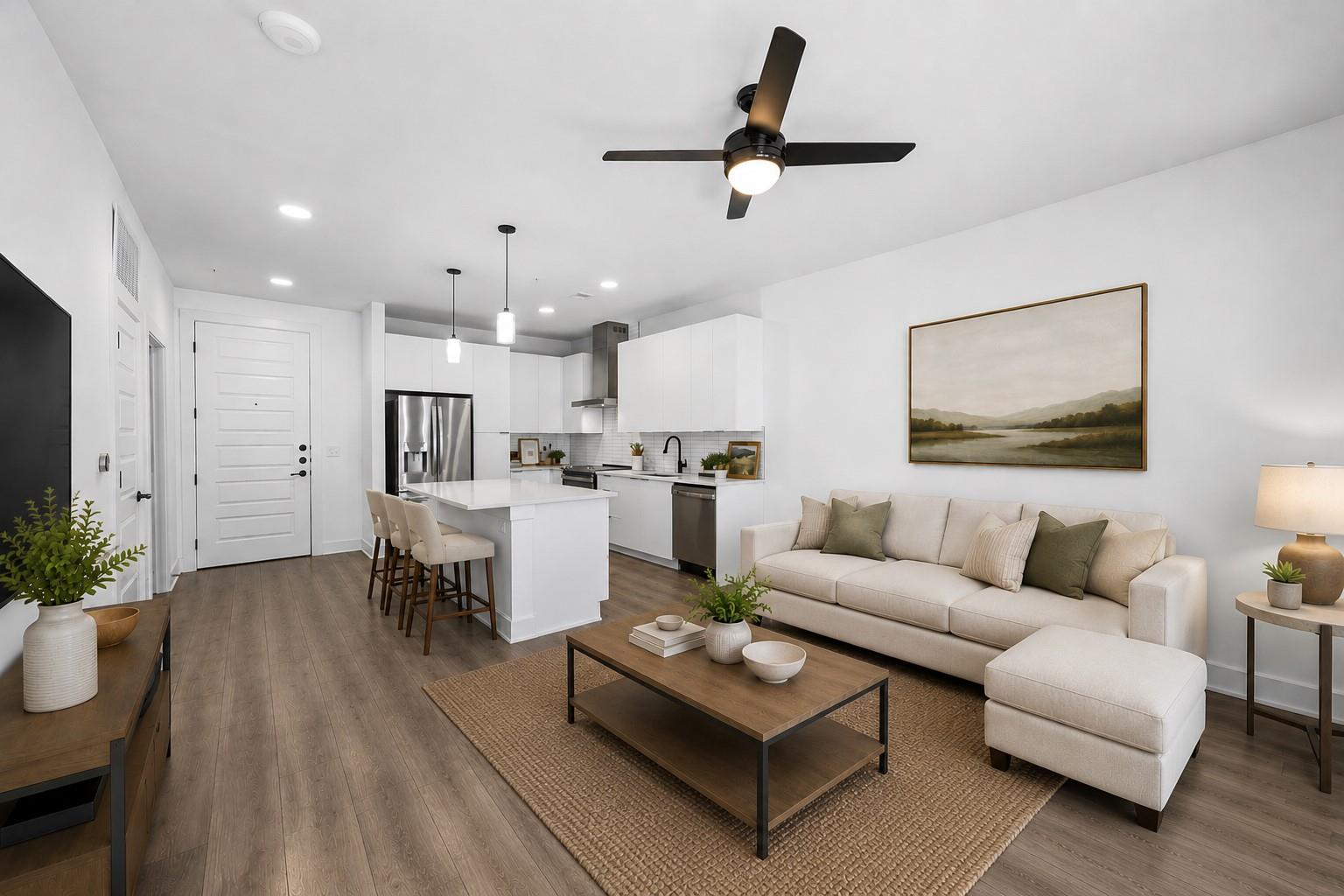 Open-concept living space featuring wood-finish f