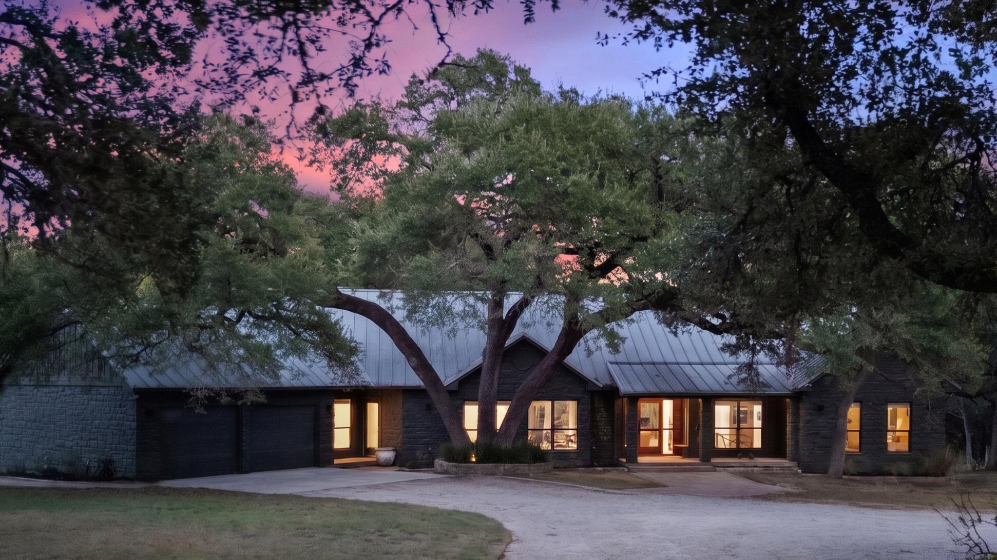 Mature oak trees frame a modern single-story resi
