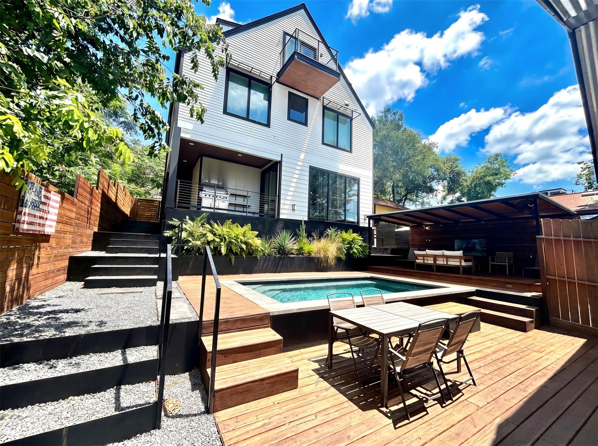 Modern exterior with white siding and black trim,