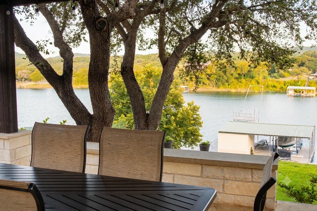 A tranquil outdoor living space offers serene wat