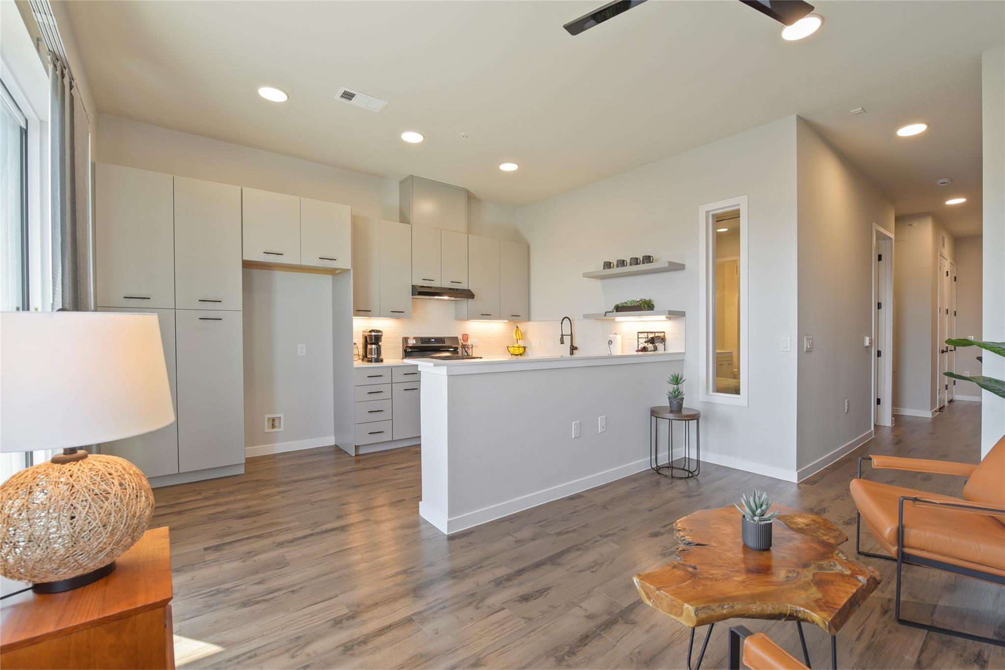 Open-concept kitchen and living area featuring wo