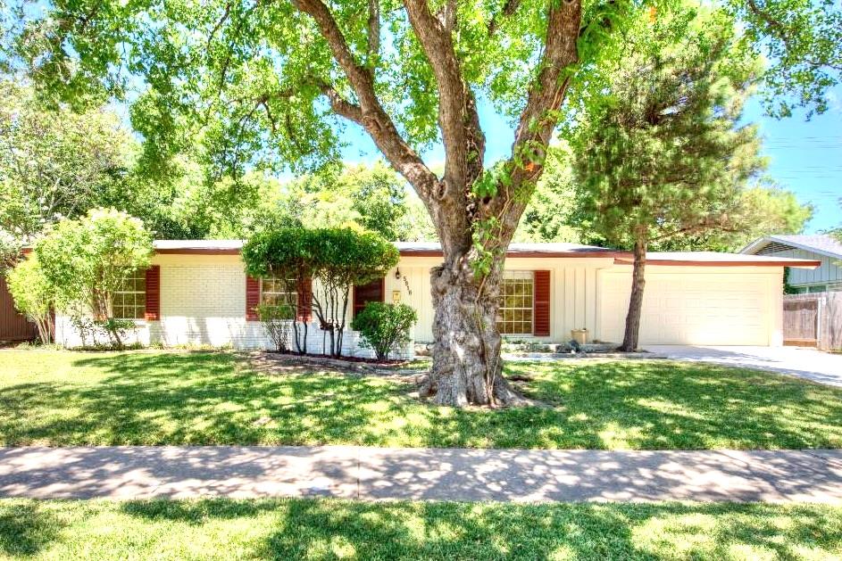 Ranch-style exterior with a two-car garage, brick