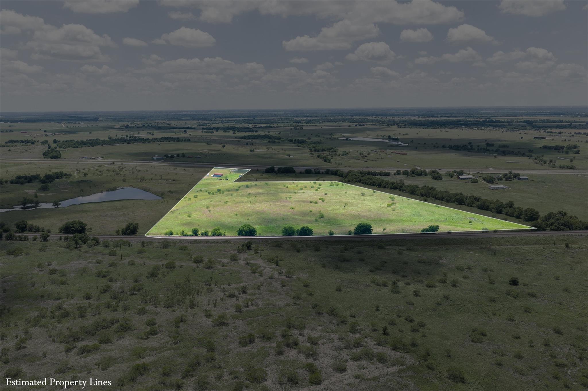 Expansive open land parcel featuring a green, gra