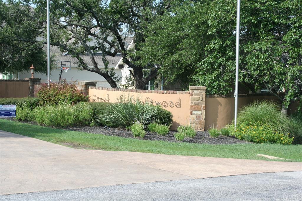 Stone and stucco entrance monument featuring inte