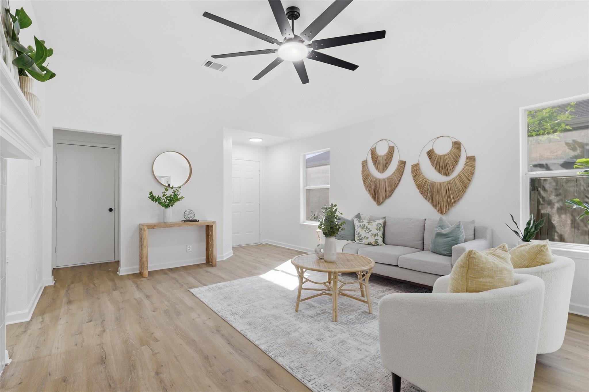 Bright living space featuring light wood-finish f