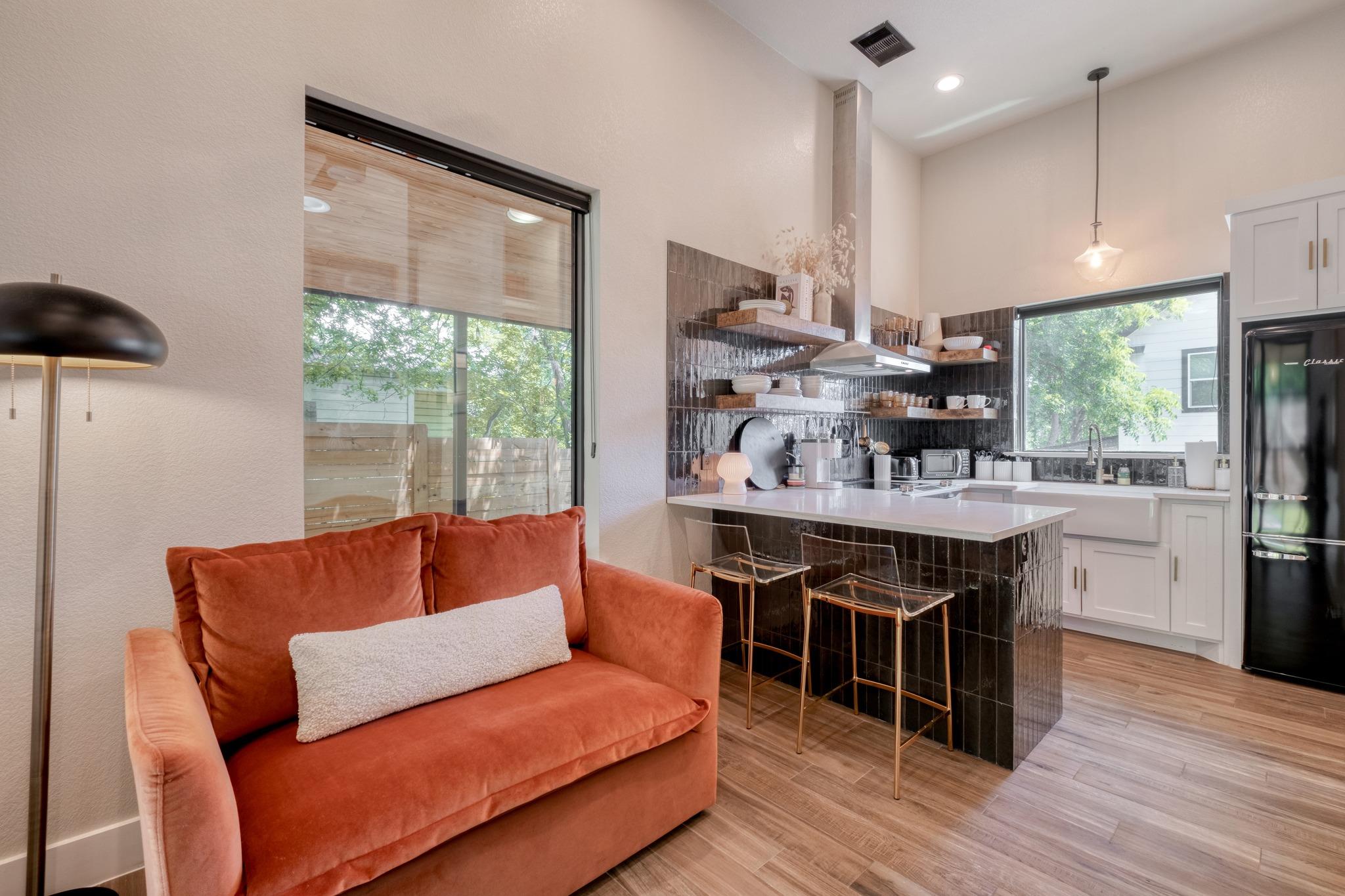 Open-concept living space featuring high ceilings