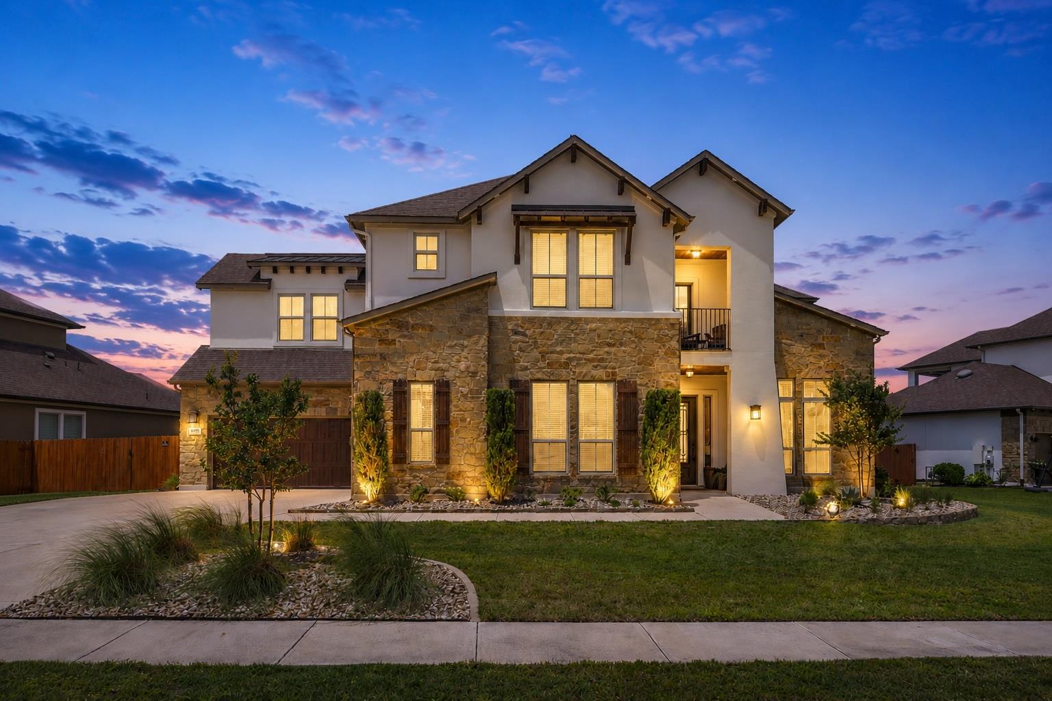 Stunning two-story exterior featuring a stone and