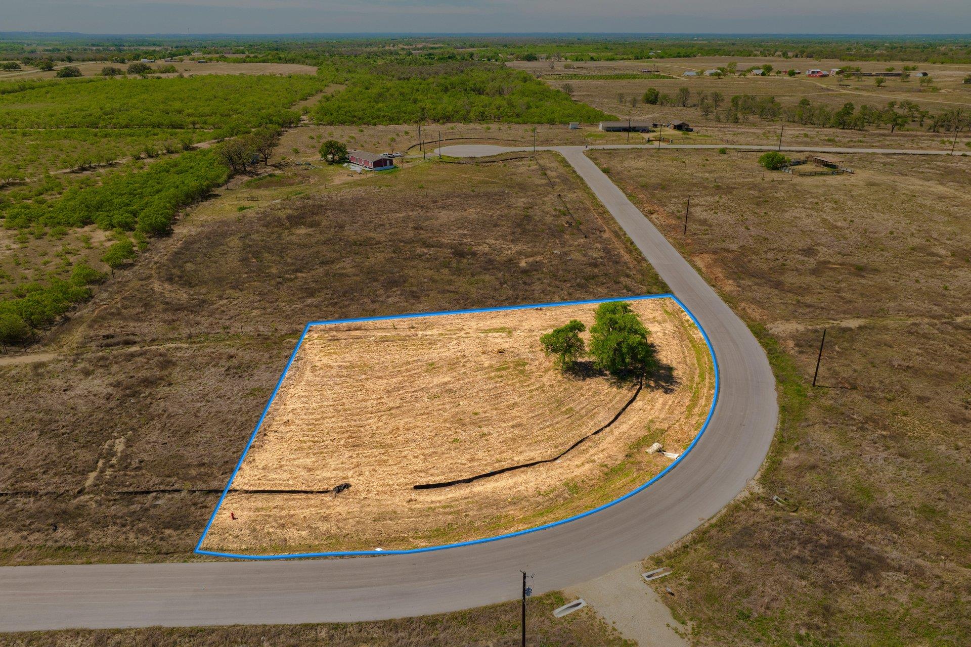 Acreage parcel with a paved road frontage, define