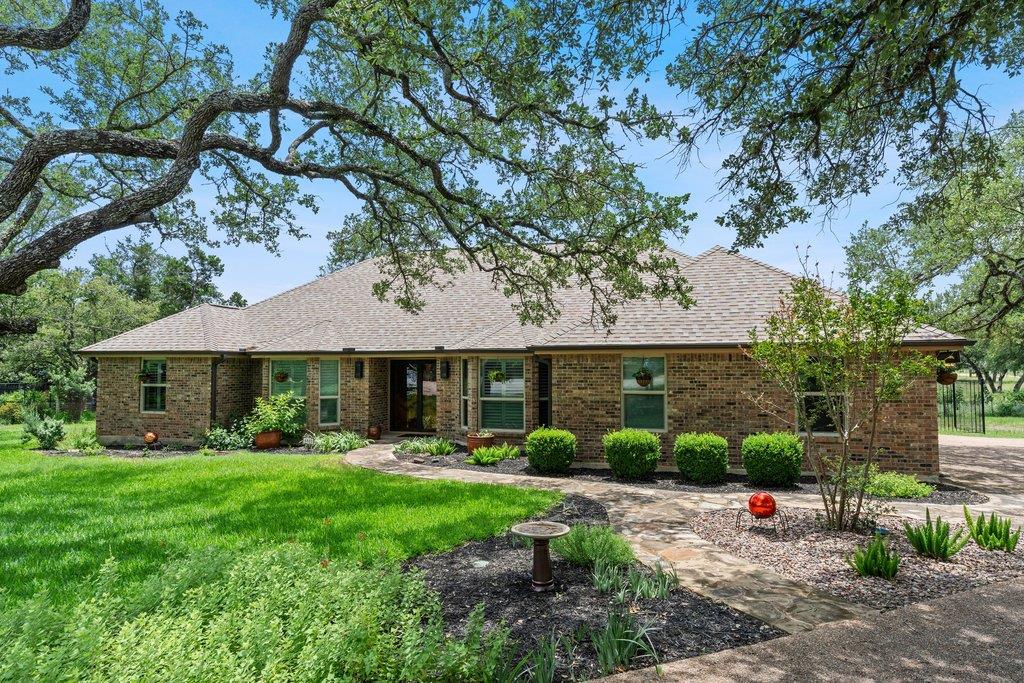 A graceful brick residence with a neatly manicure