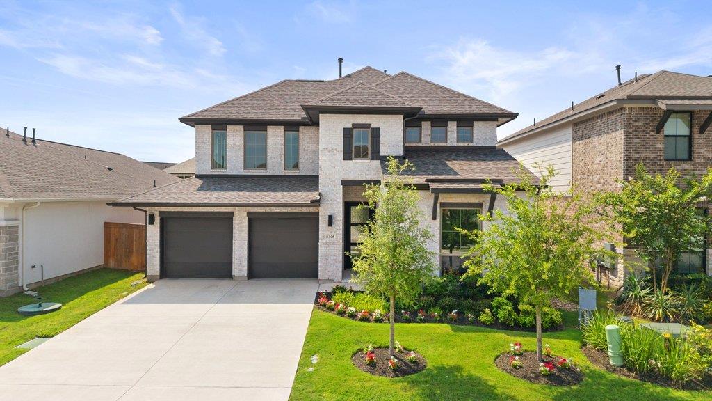 A well-maintained lawn and verdant landscaping el