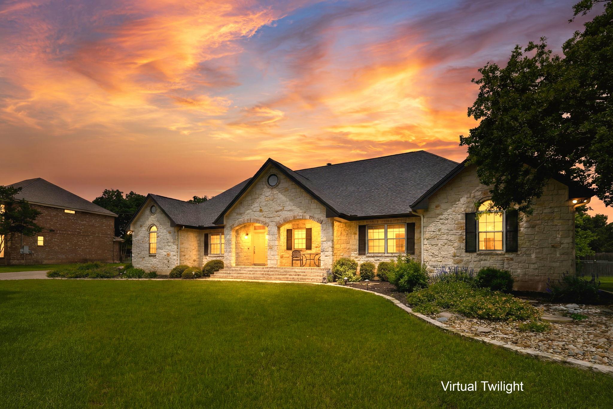 Stone facade residence with a prominent gabled ro