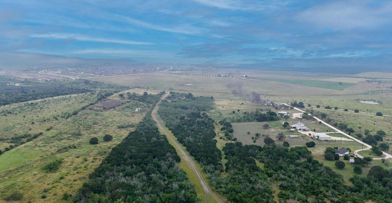 Expansive rural landscape featuring a mix of open