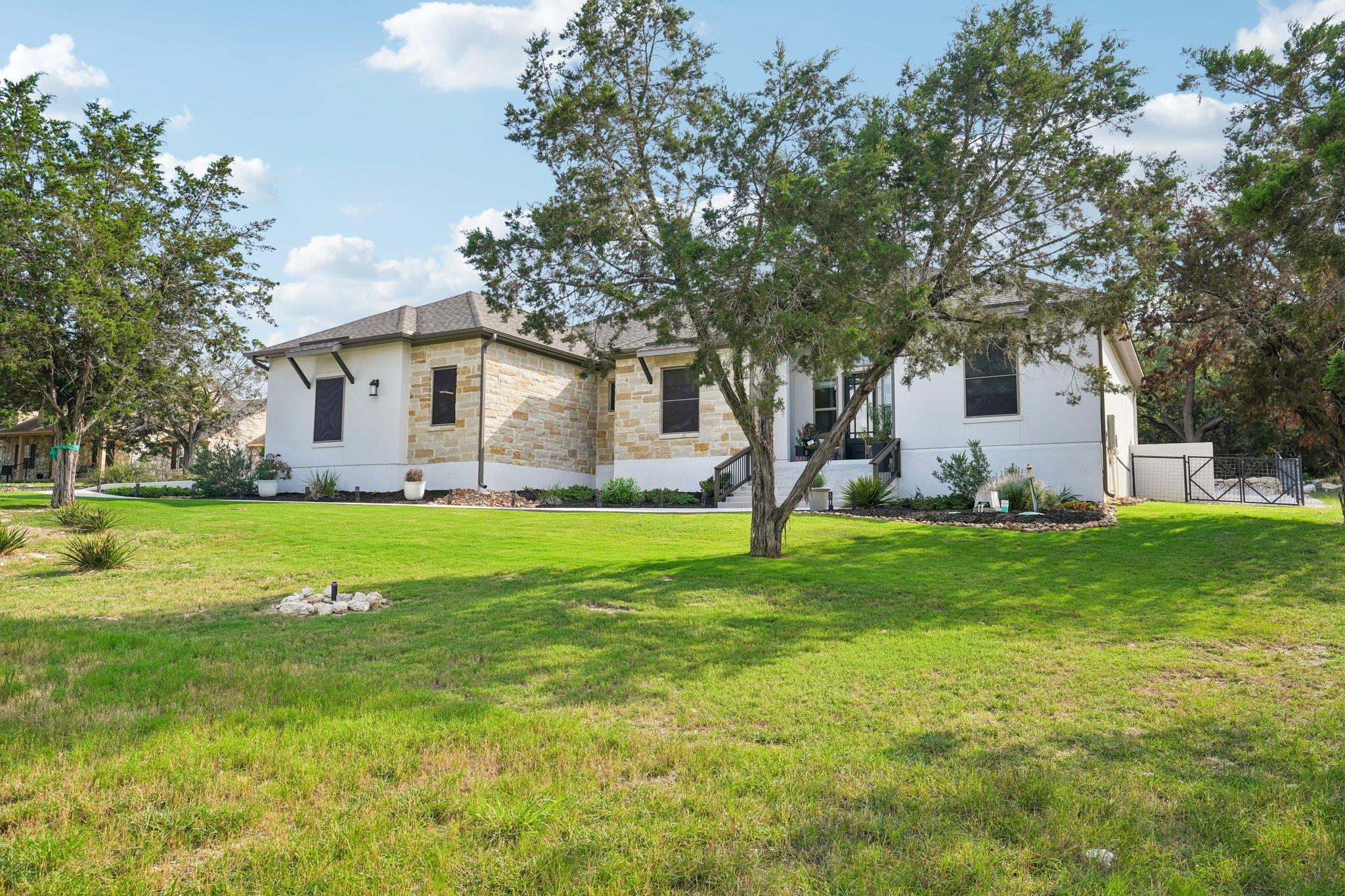 Exterior featuring a stone and stucco facade, dar