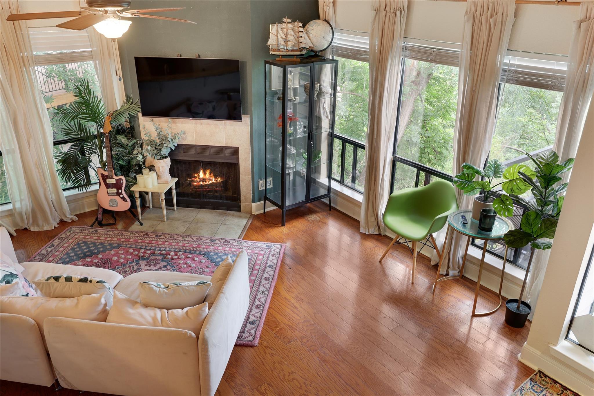 Living area featuring wood-finish flooring, a fir