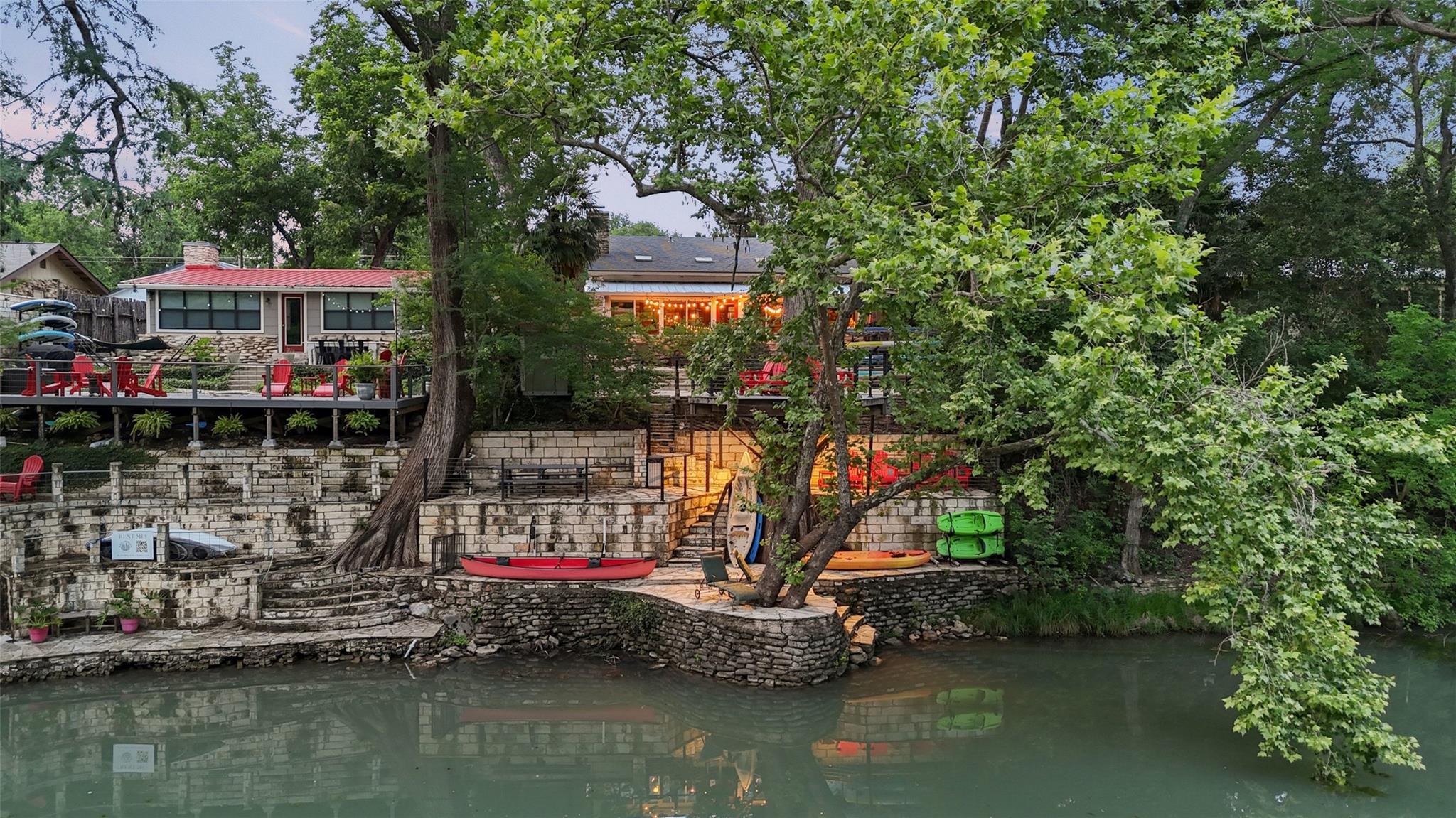 Waterfront property featuring extensive stone ter