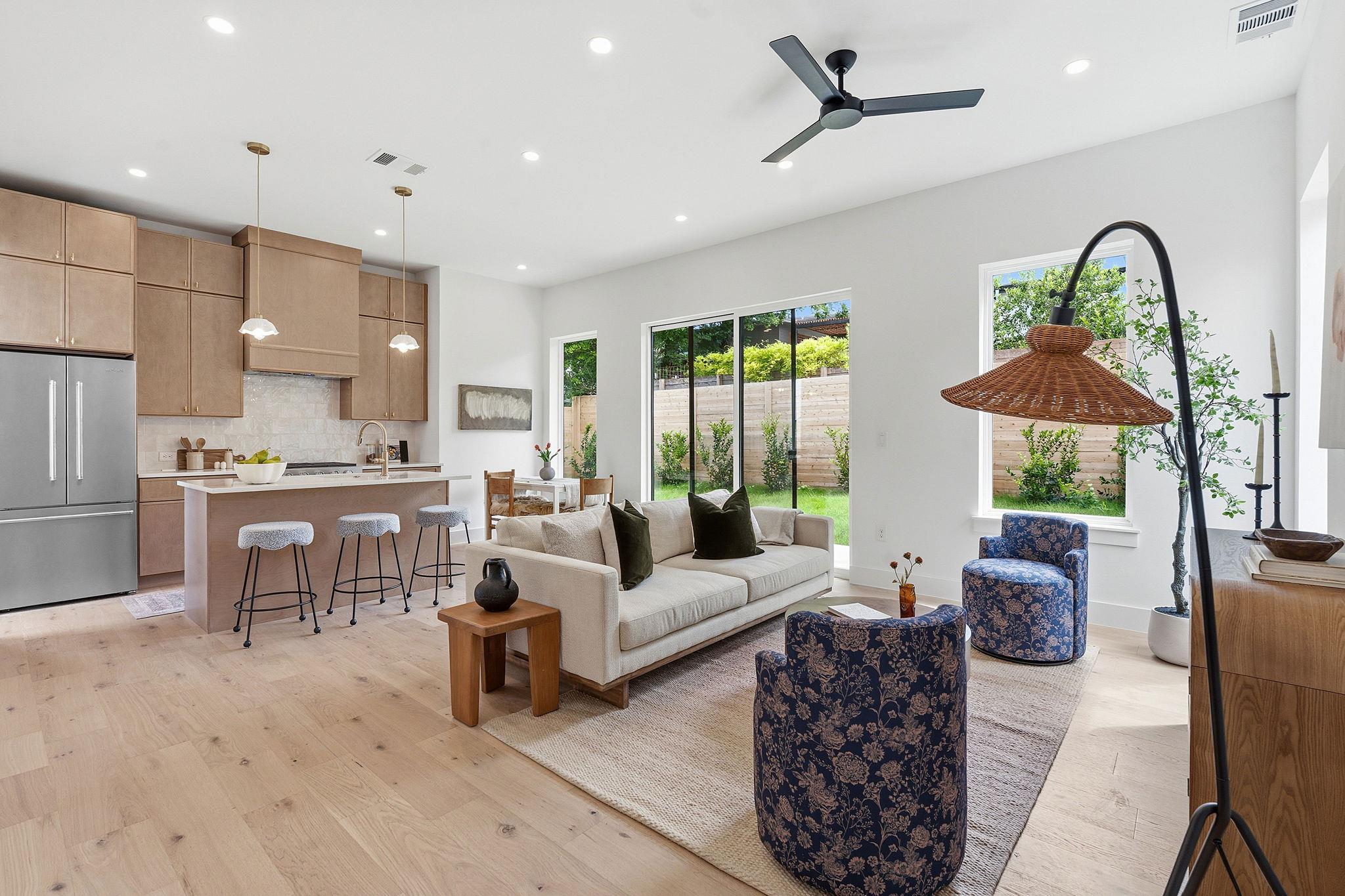 Open-concept living space featuring wood-finish f