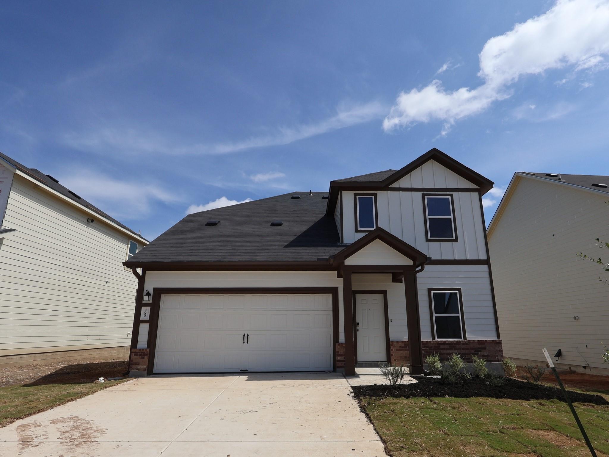 A newly constructed residence boasts an attached 
