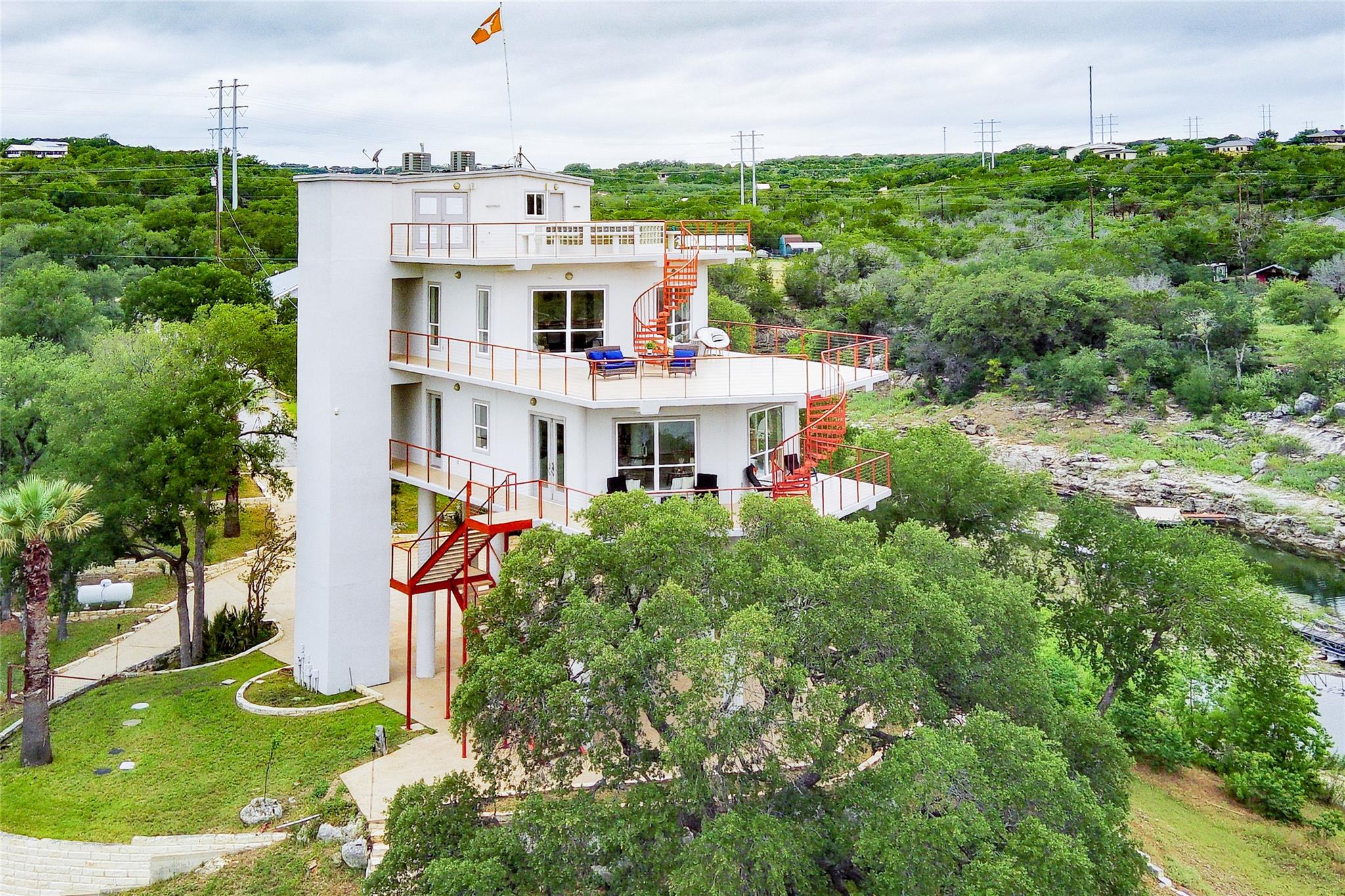 Multi-level white stucco residence featuring exte