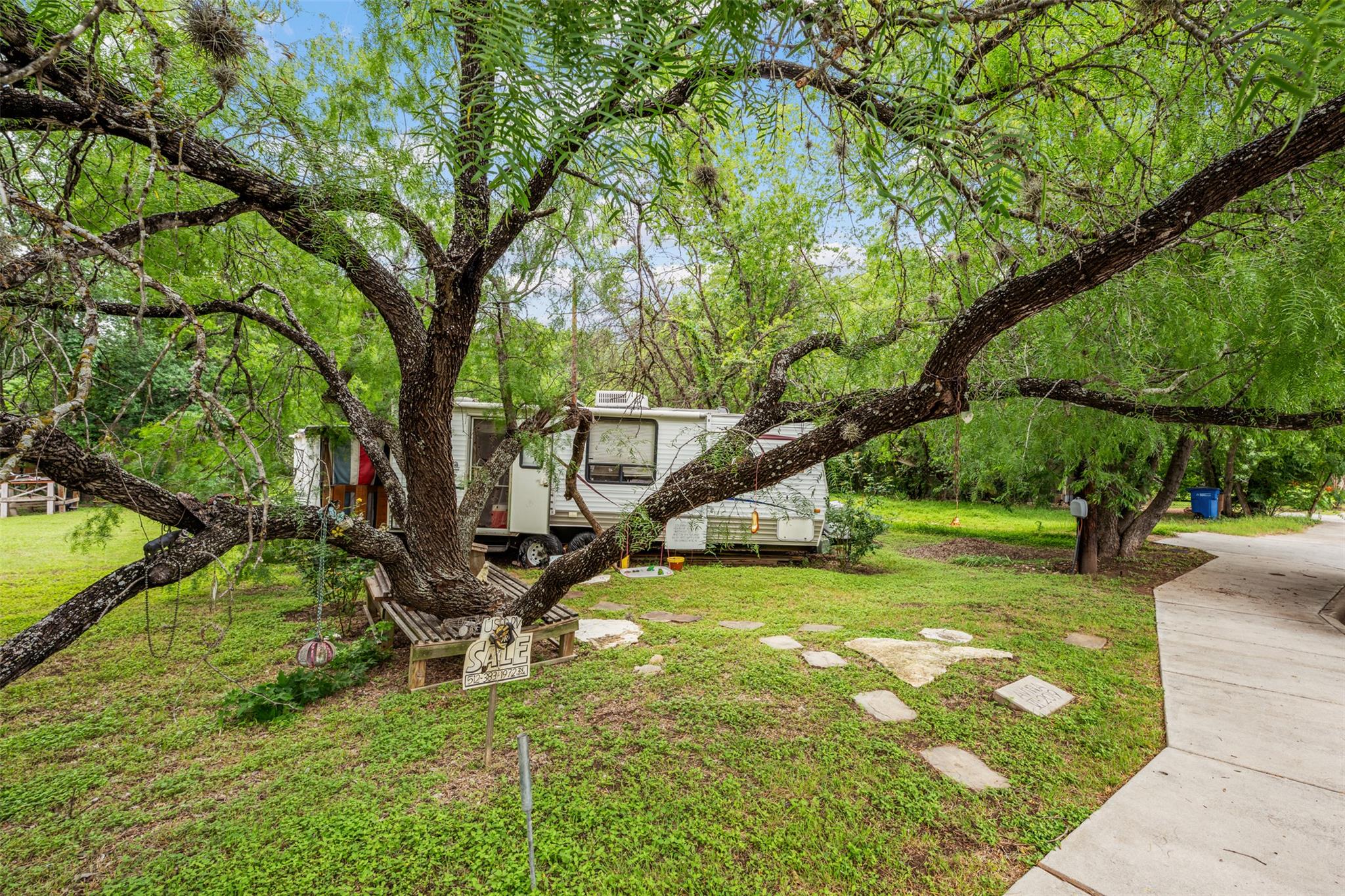 Mature trees shade this generously sized yard wit