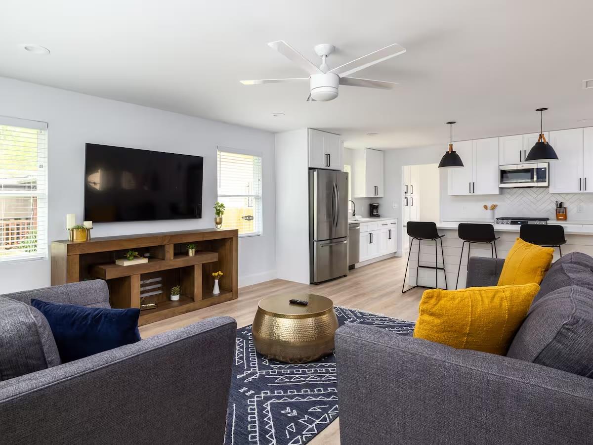 Open-concept living area featuring light wood-fin