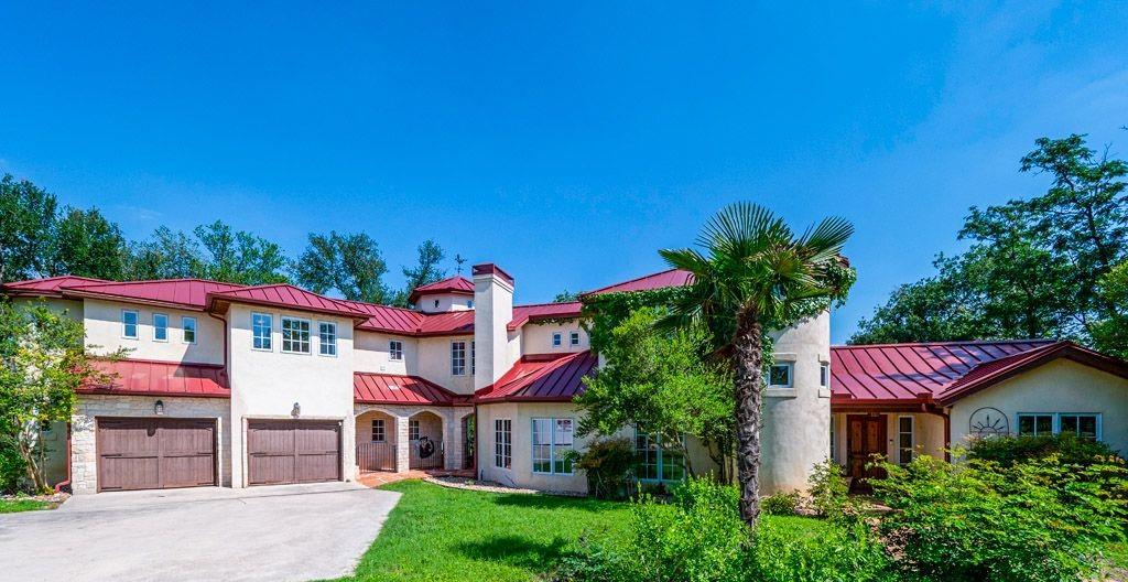 Mediterranean-style residence featuring a red met
