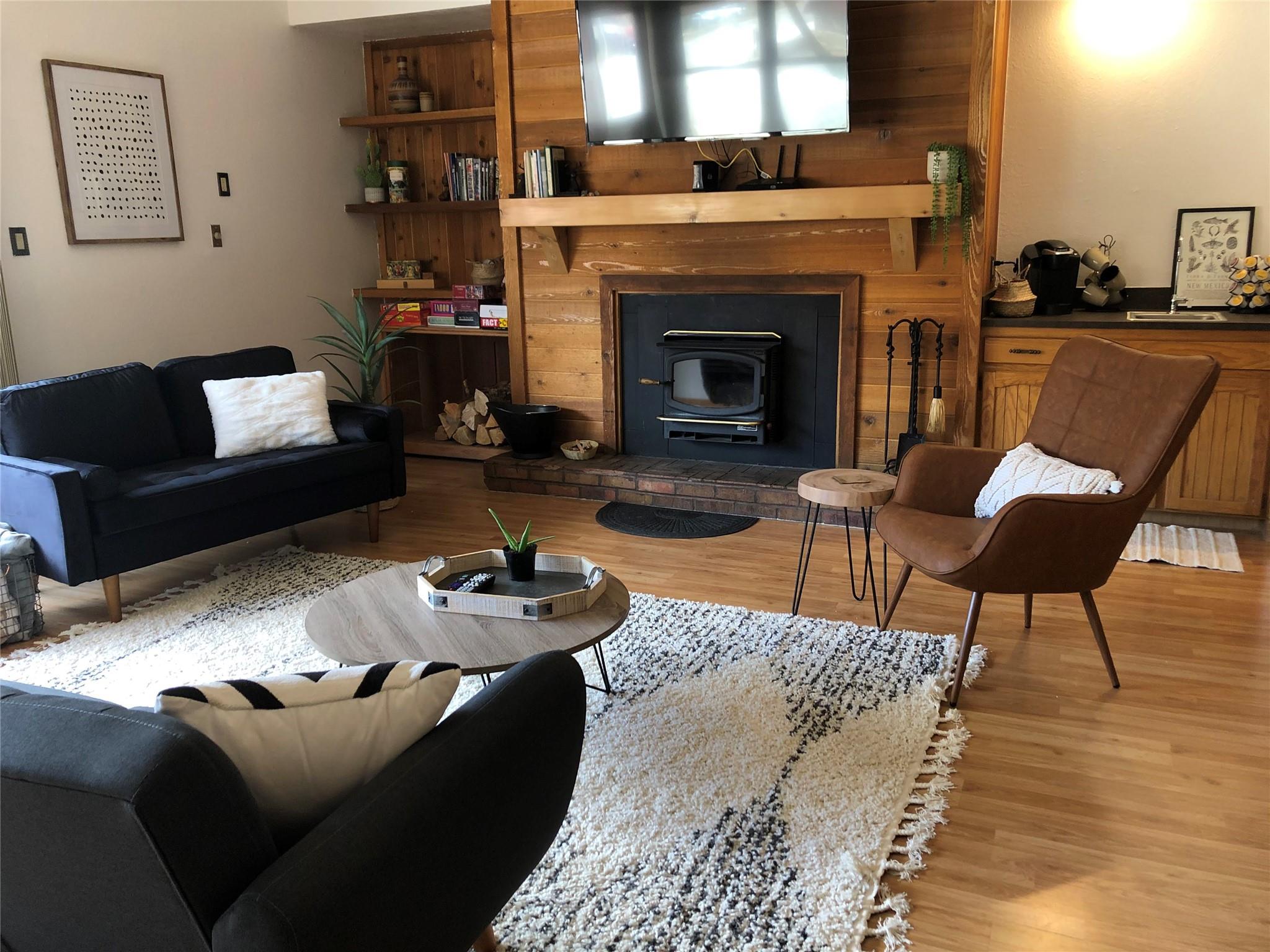 Hardwood-finish flooring throughout this living s