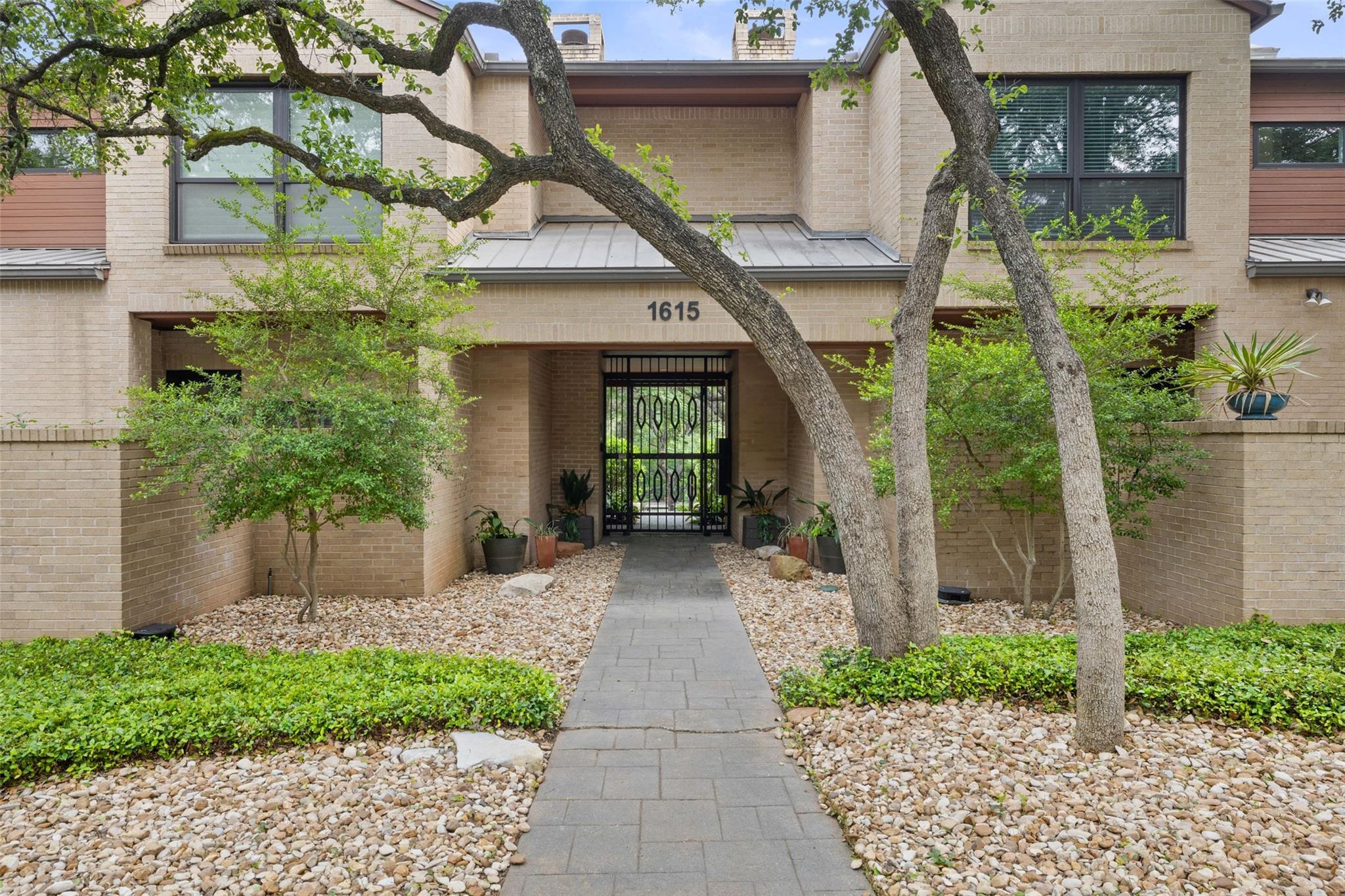 A welcoming stone pathway guides to the secure, g