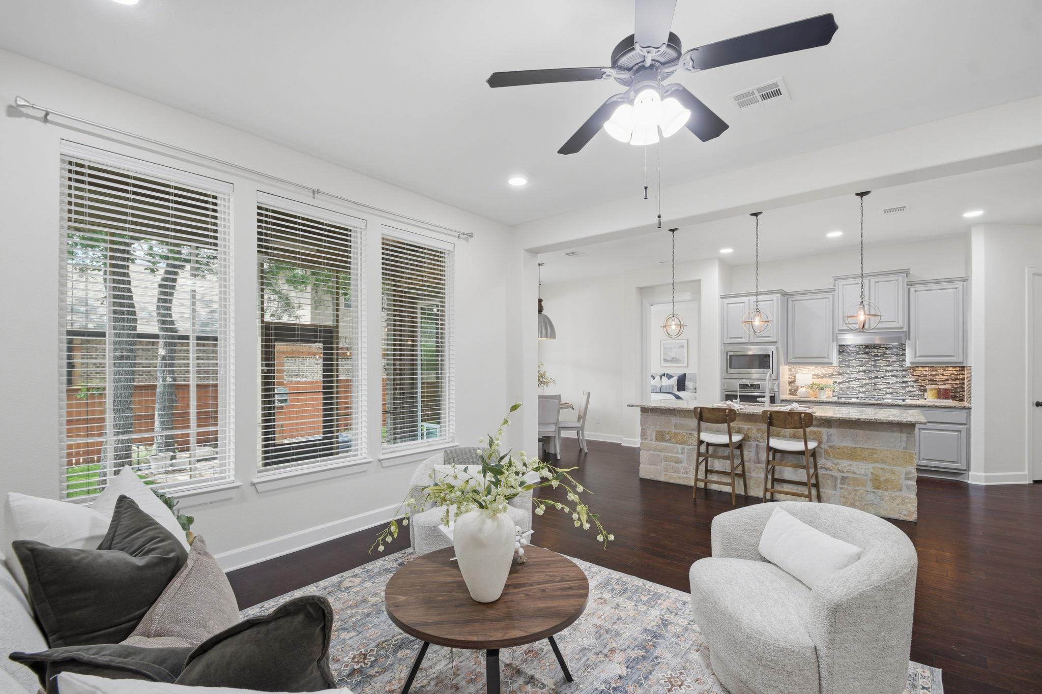 Open-concept living area featuring rich wood-fini