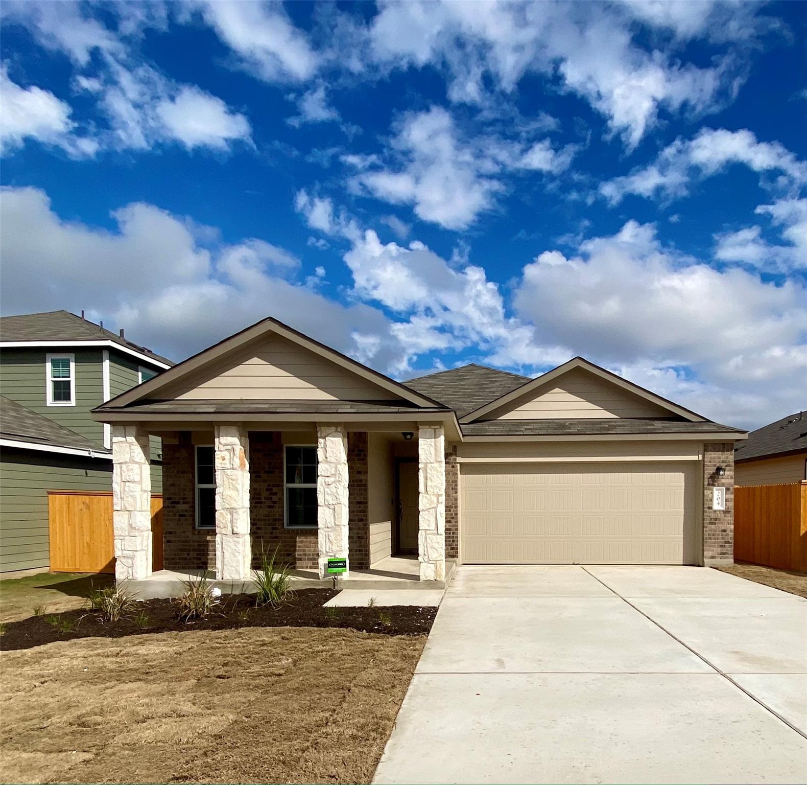 Contemporary home featuring a combination brick a