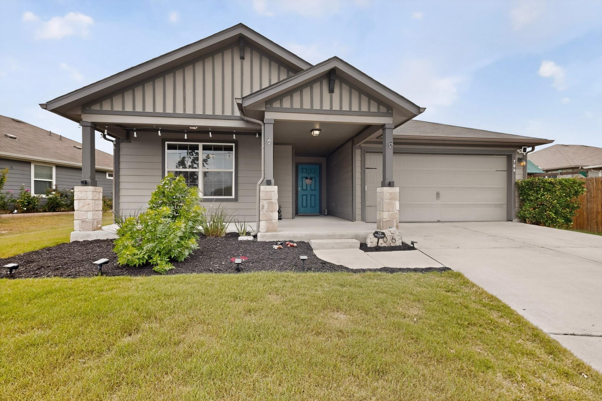 Single-story home featuring a covered front entry