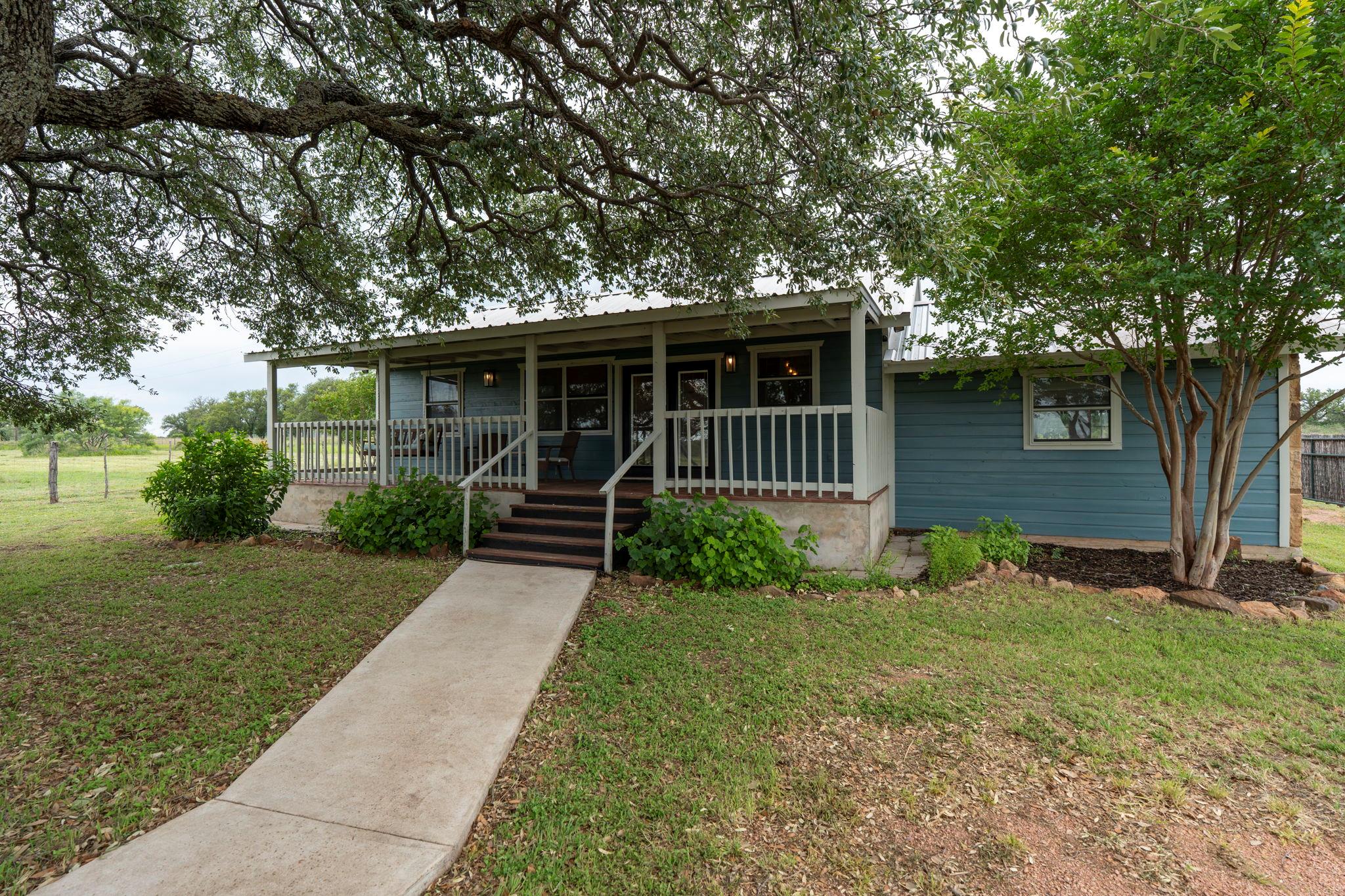 Single-story residence featuring blue siding, a c