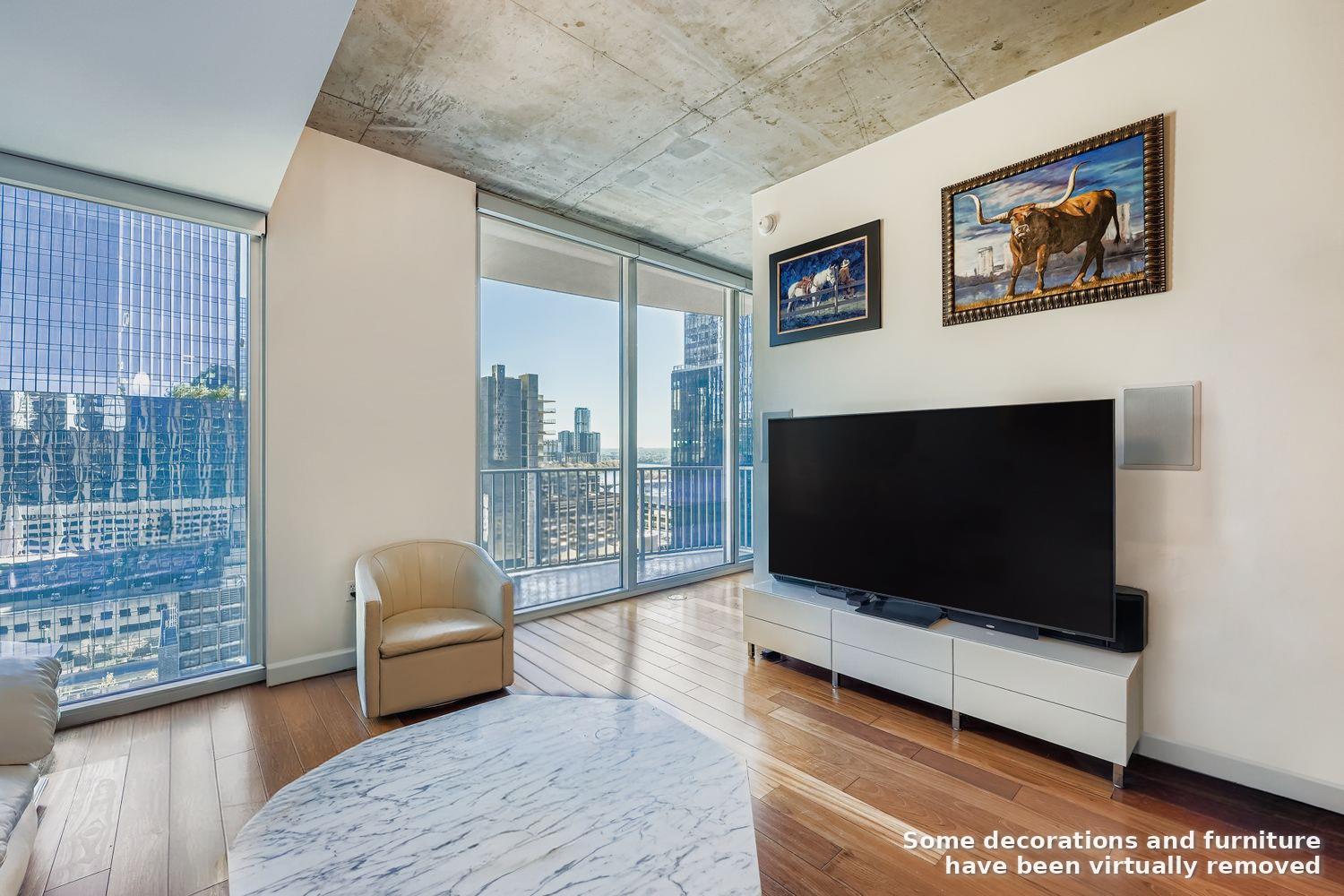 Floor-to-ceiling windows frame a dynamic cityscap