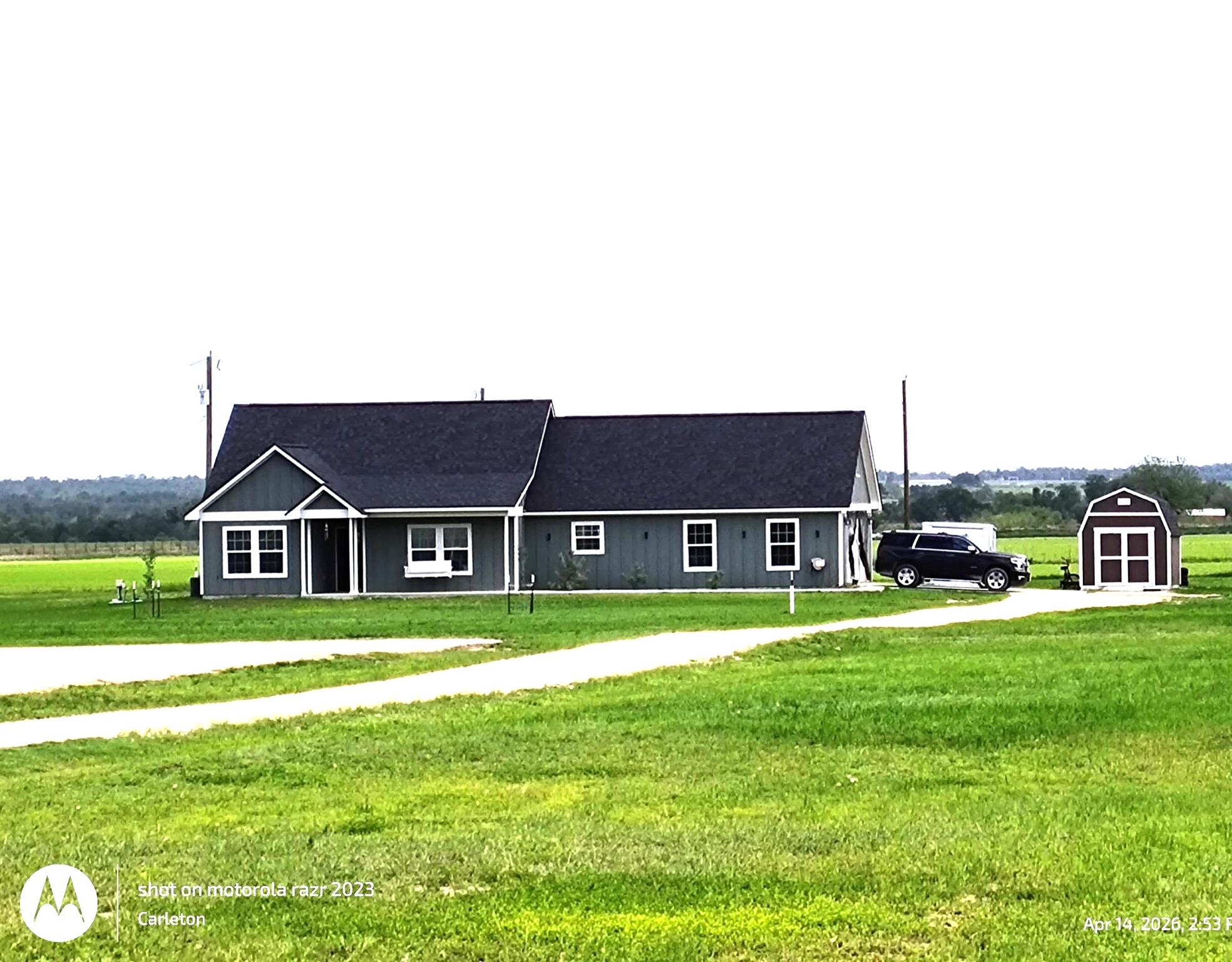 A welcoming home with ample green space and a con