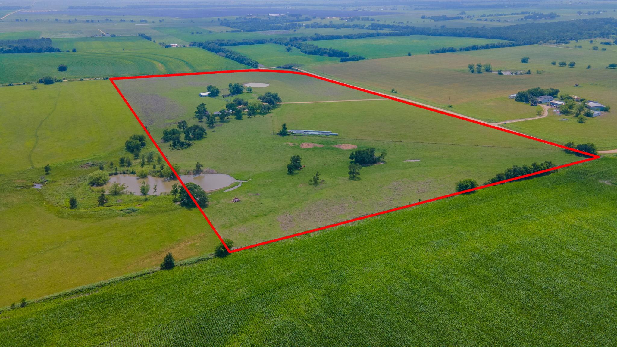 Expansive agricultural land featuring a prominent
