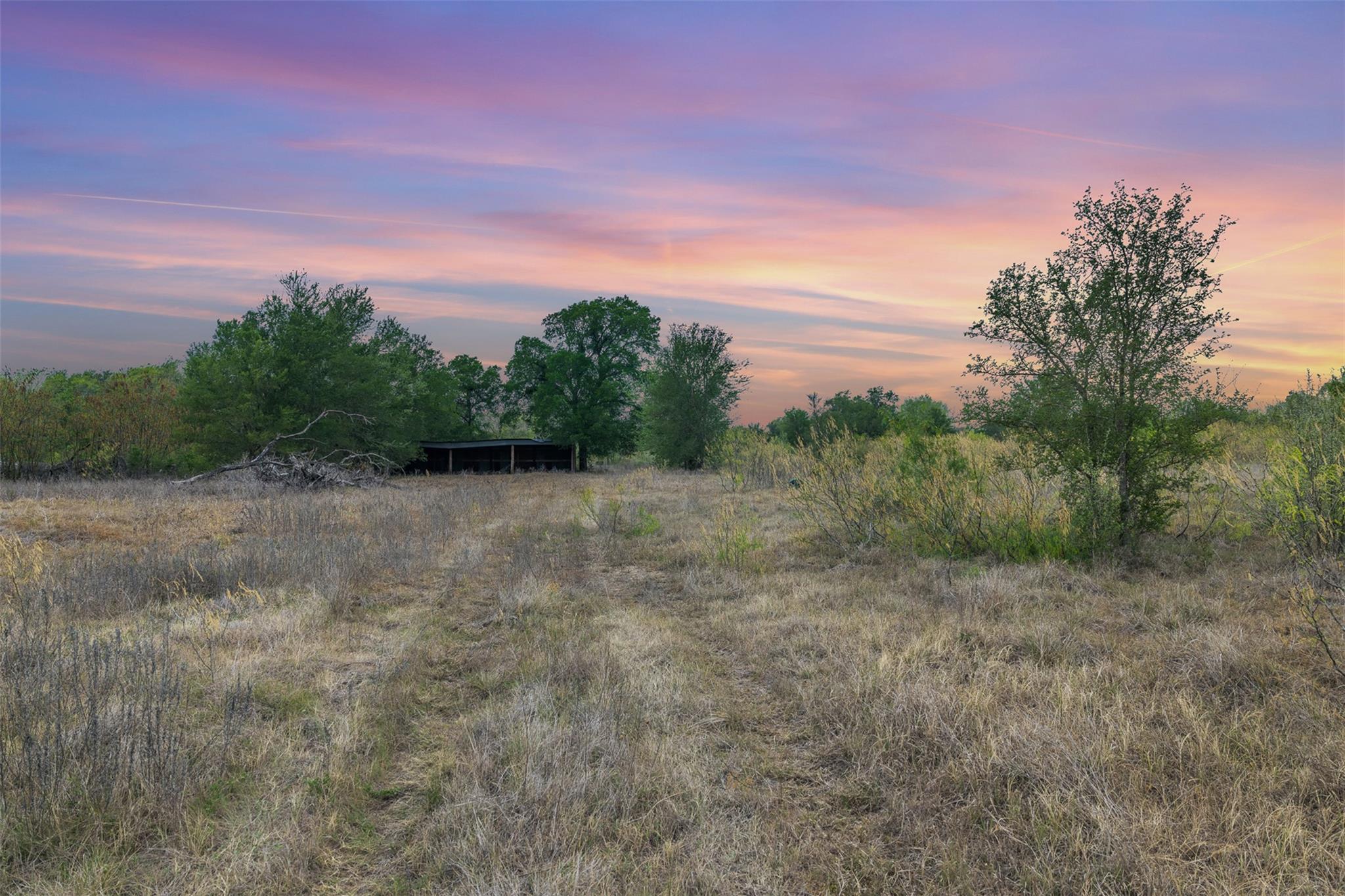 Nature at dusk featuring a view of rural / pastor