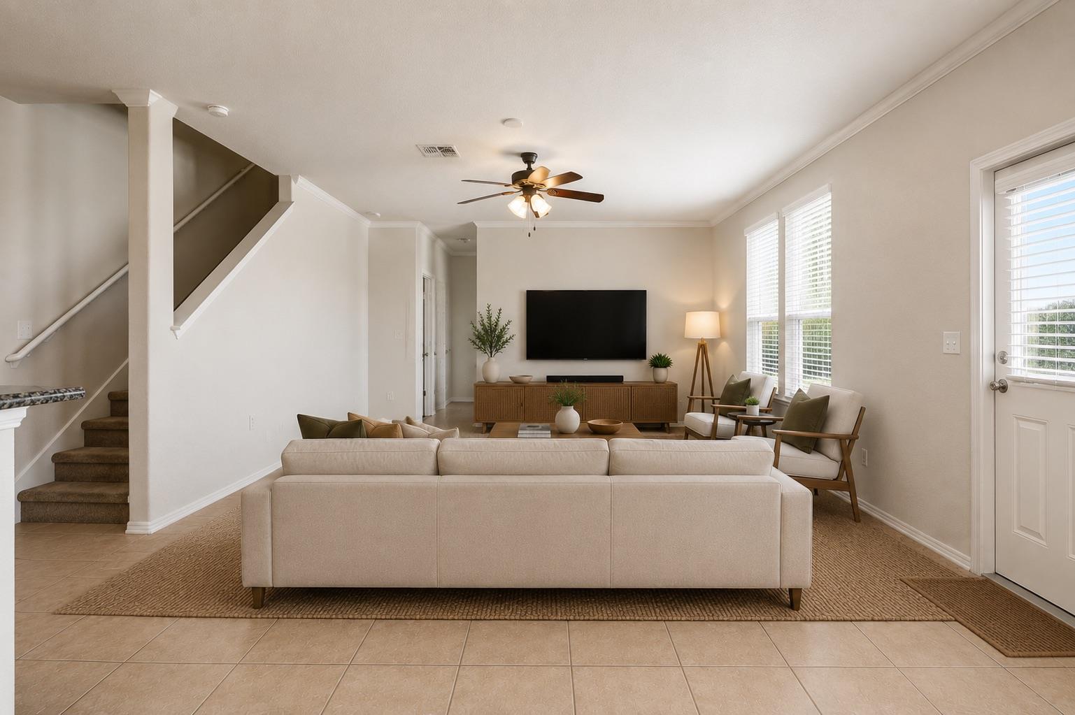 An inviting family room boasts high ceilings and 