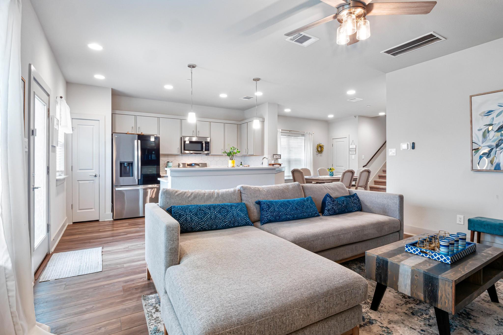 Open-concept living area with wood-finish floorin