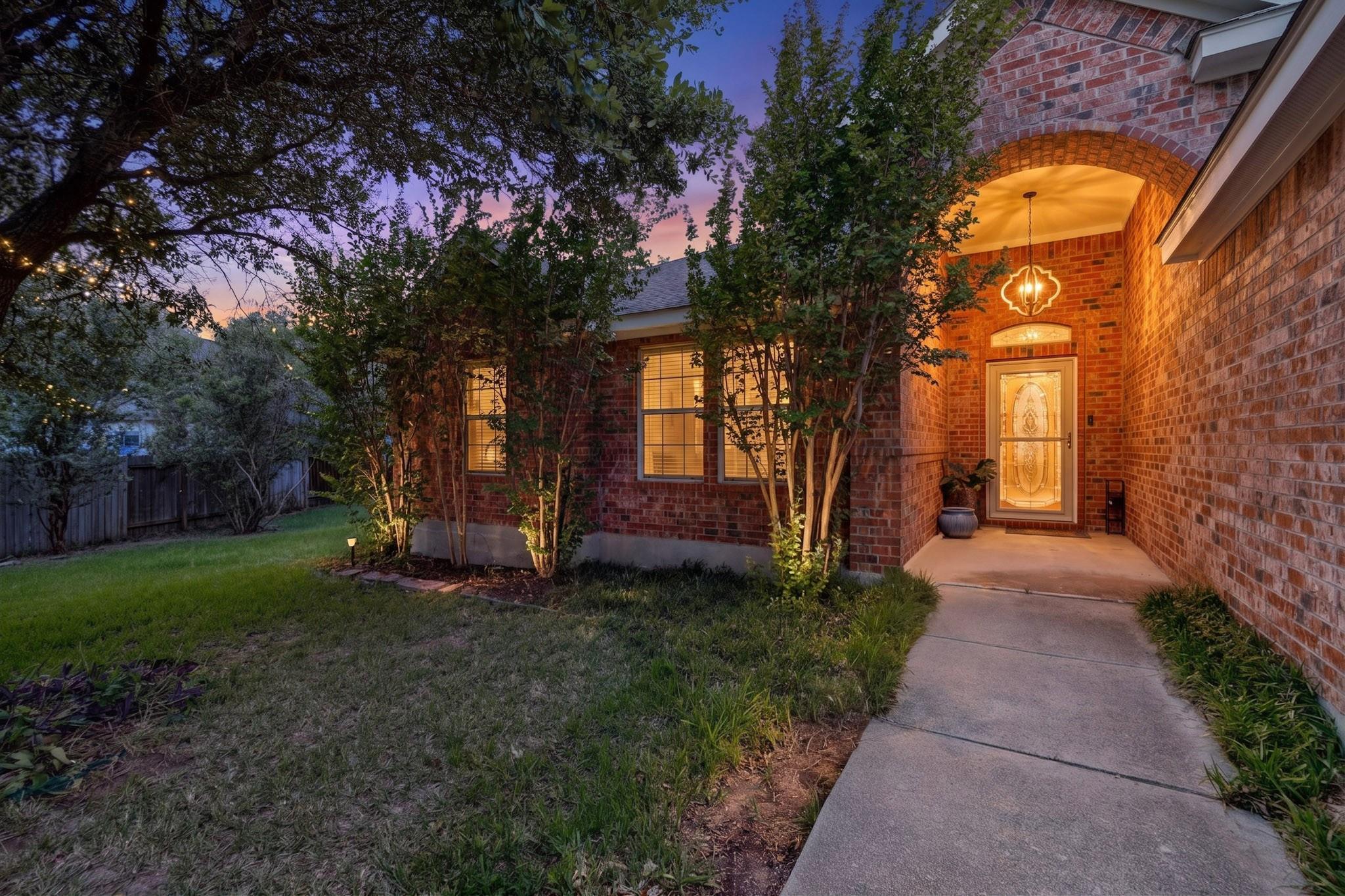 Illuminated brick facade and inviting entryway cr