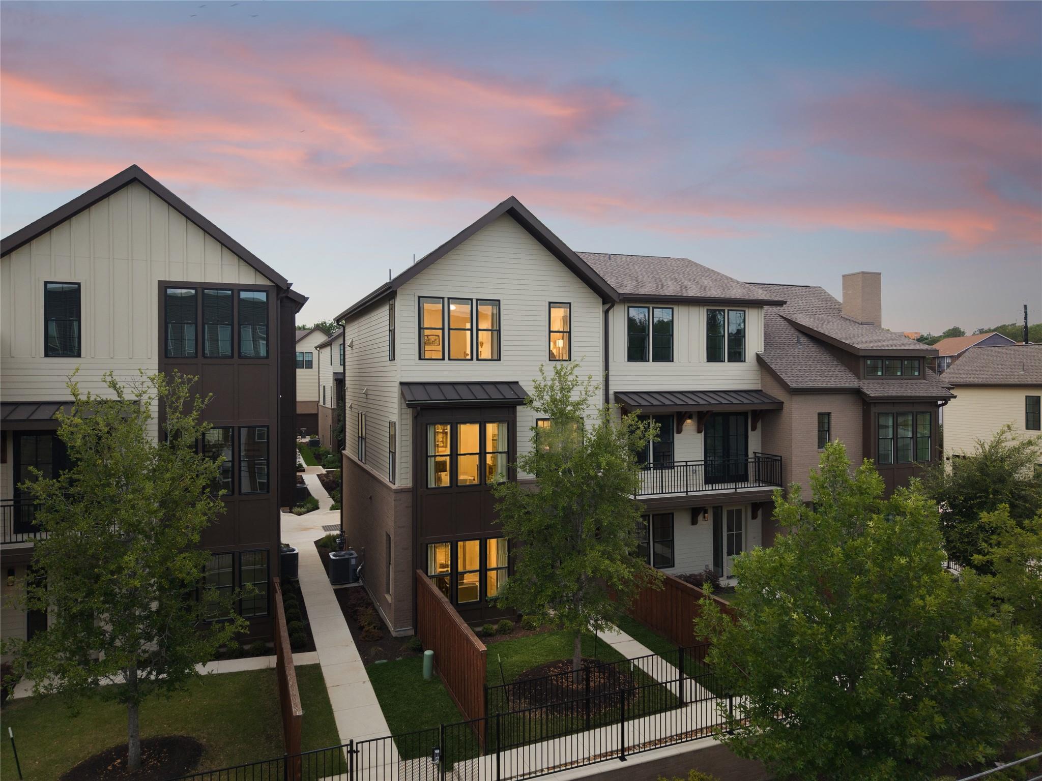 Contemporary multi-story townhomes with distinct 