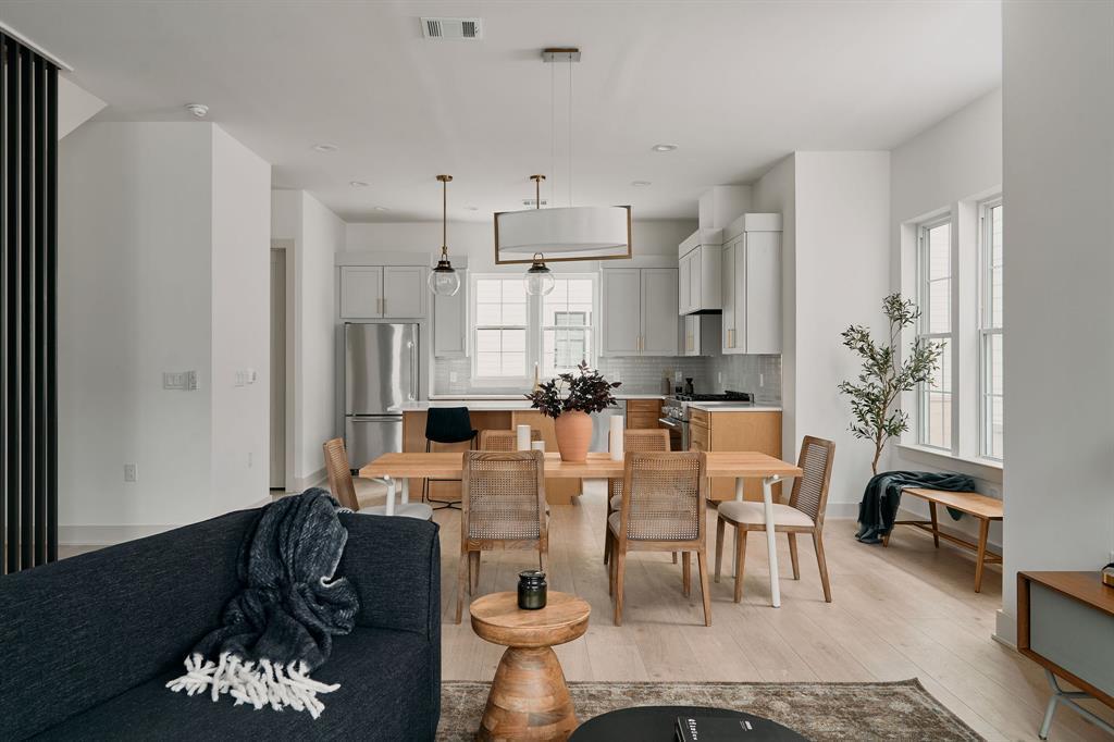 Open-concept living space featuring light wood-fi