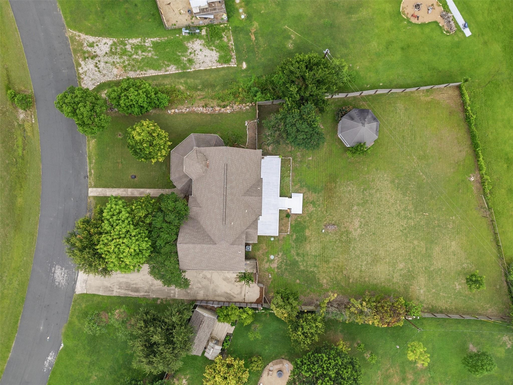 An aerial perspective reveals a private yard, mat