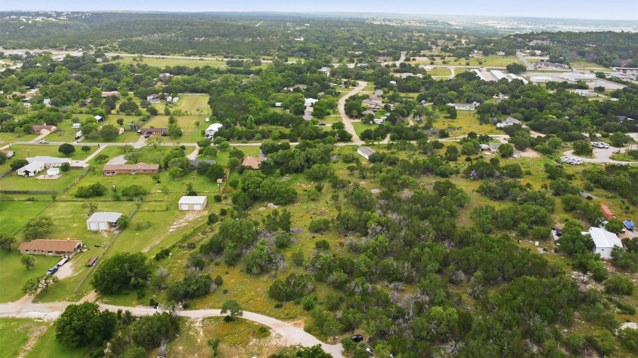 Expansive aerial landscape featuring scattered re