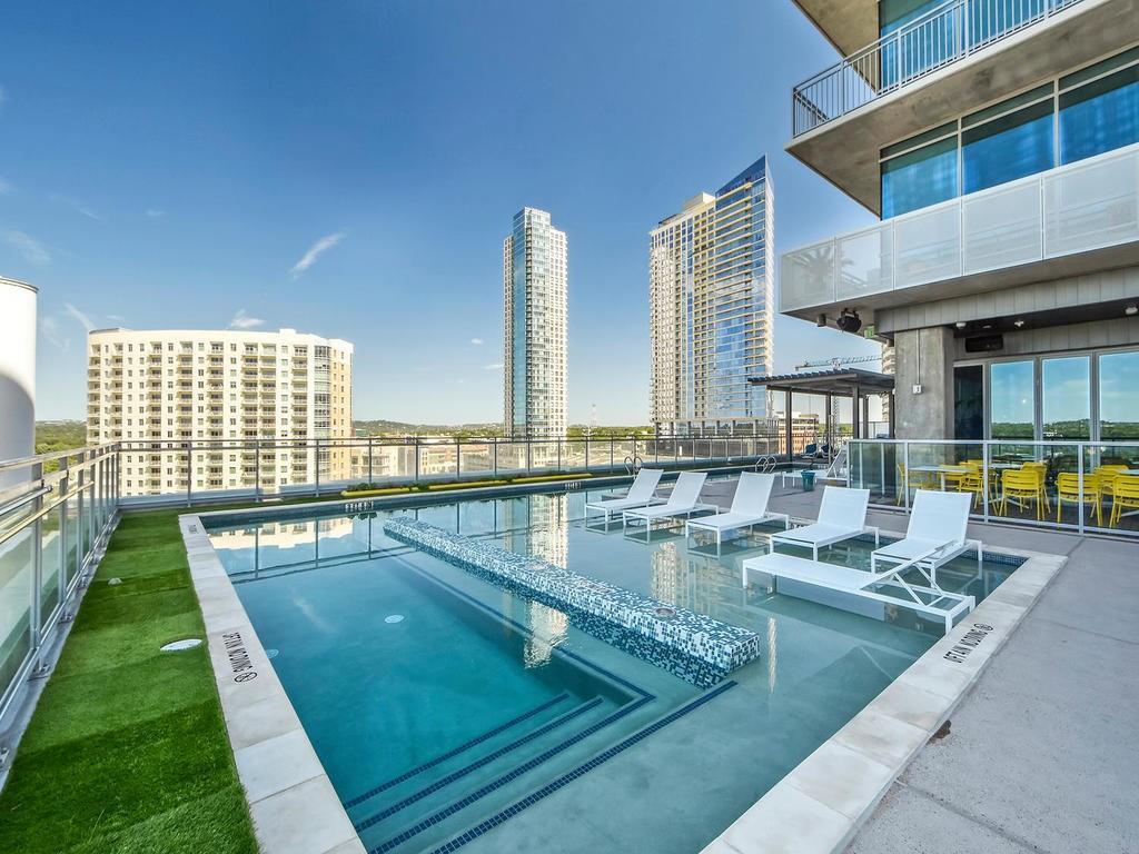 City skyline views from a rooftop pool with subme