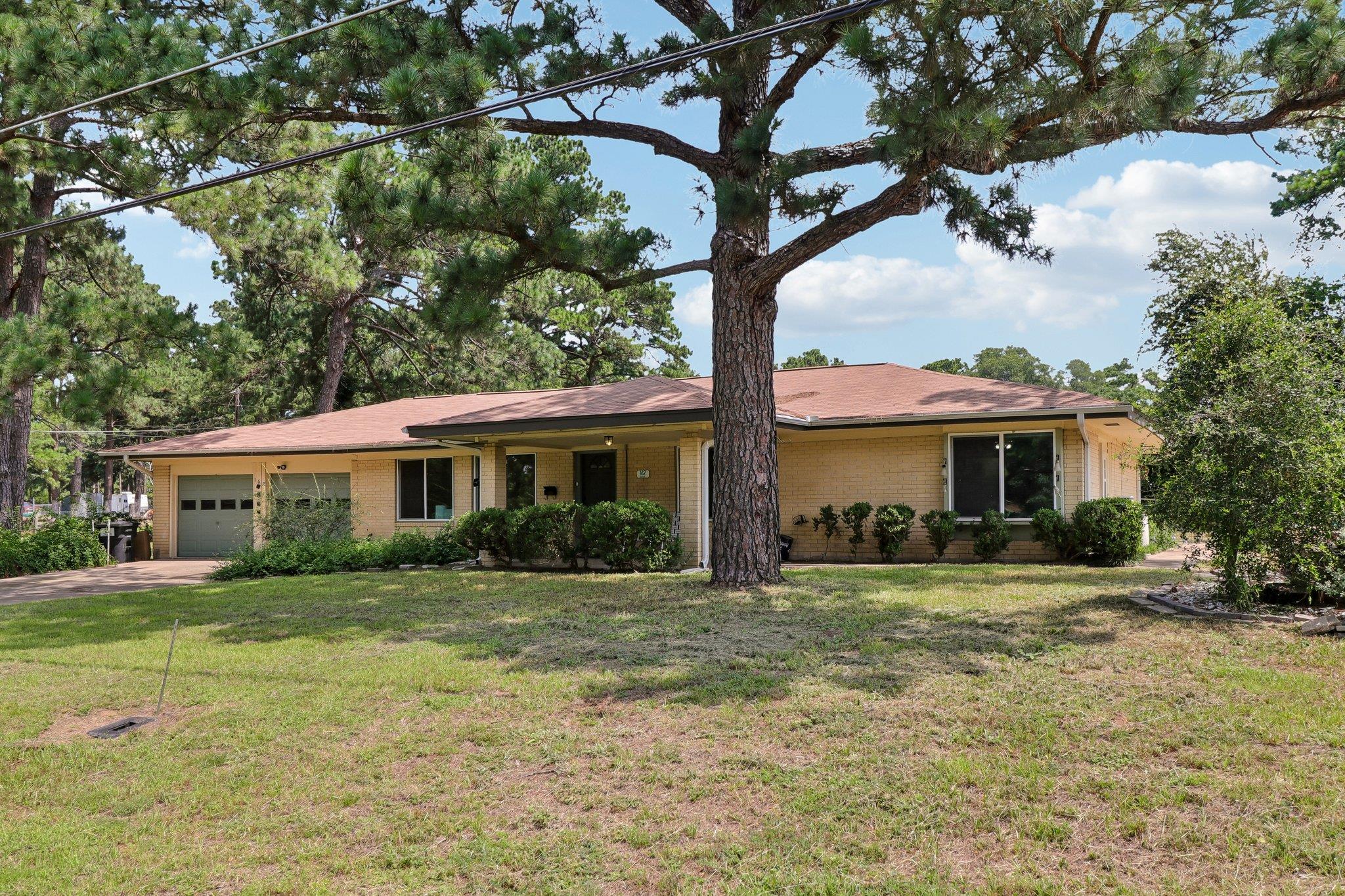 A classic brick exterior and well-maintained land