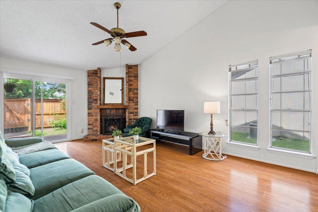 A well-lit living space features rich hardwood fl