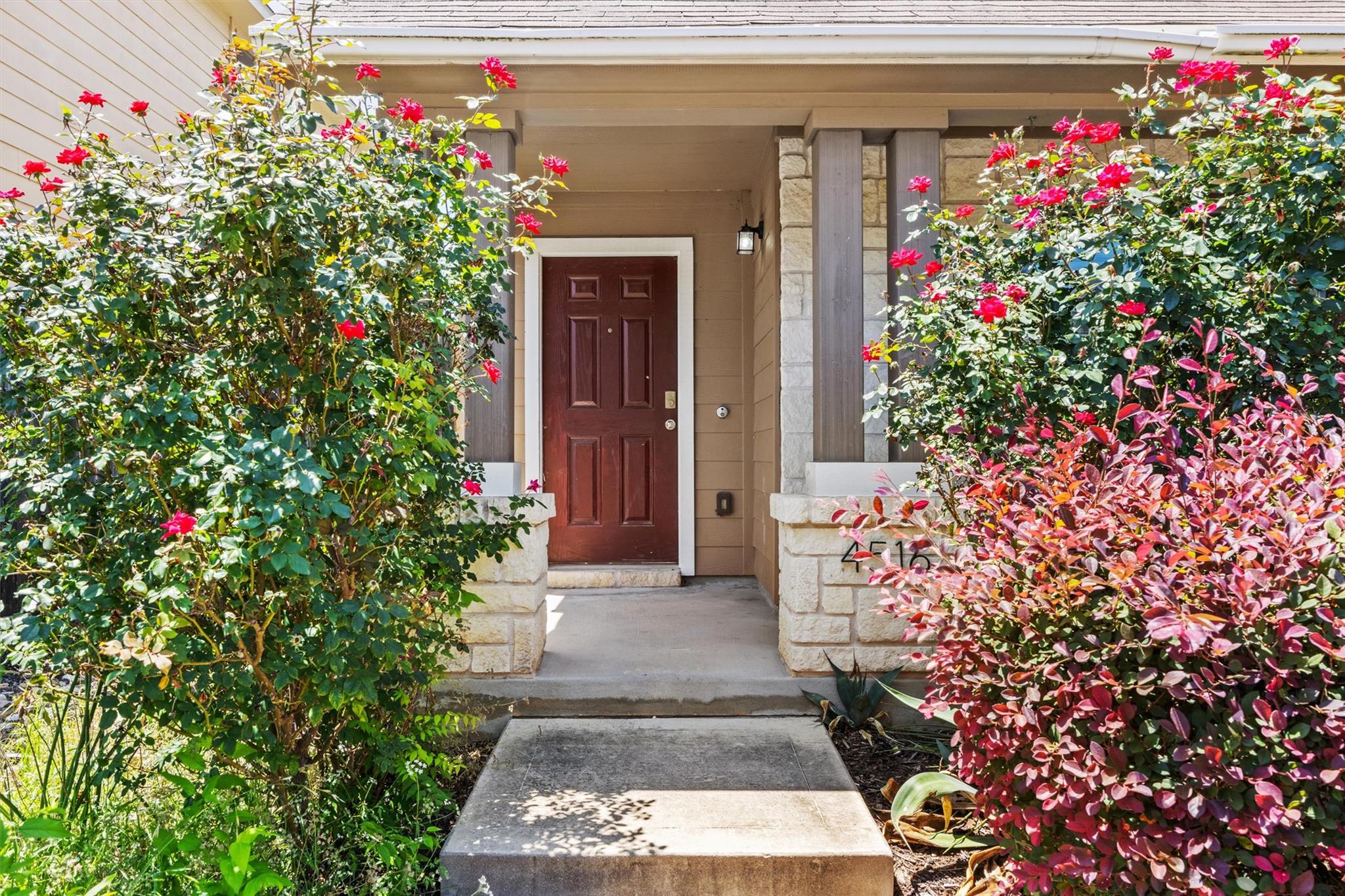 Covered entry with stone columns