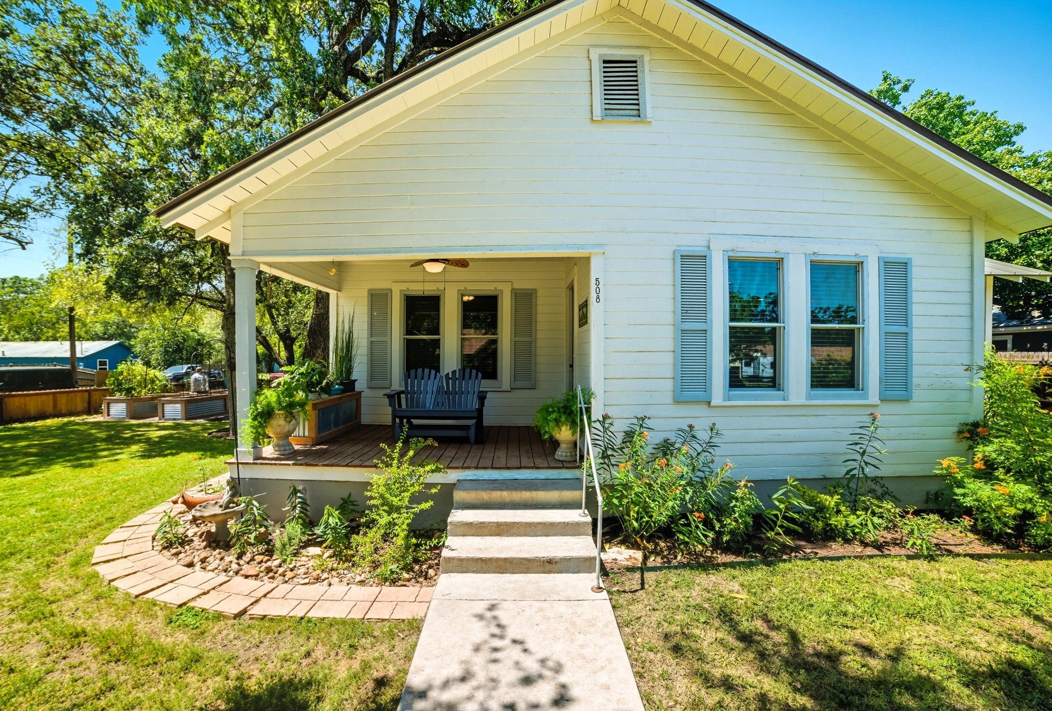 A charming cottage facade awaits, boasting a welc